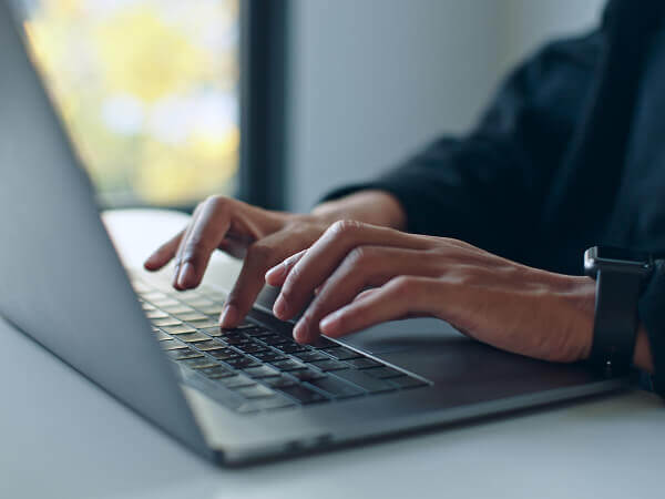 A person using laptop.