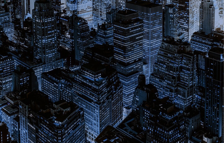 View of several illuminated buildings in the city