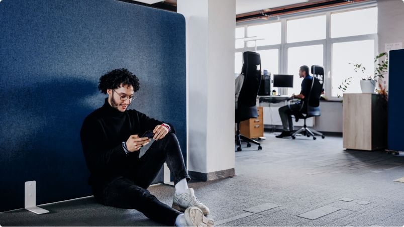 Person using cell phone inside a company